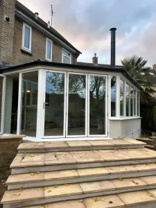 white aluminium bifold door on conservatory